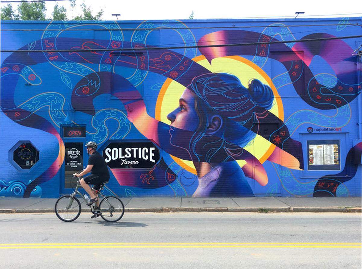Nick Napoletano's mural on the front of Solstice Tavern