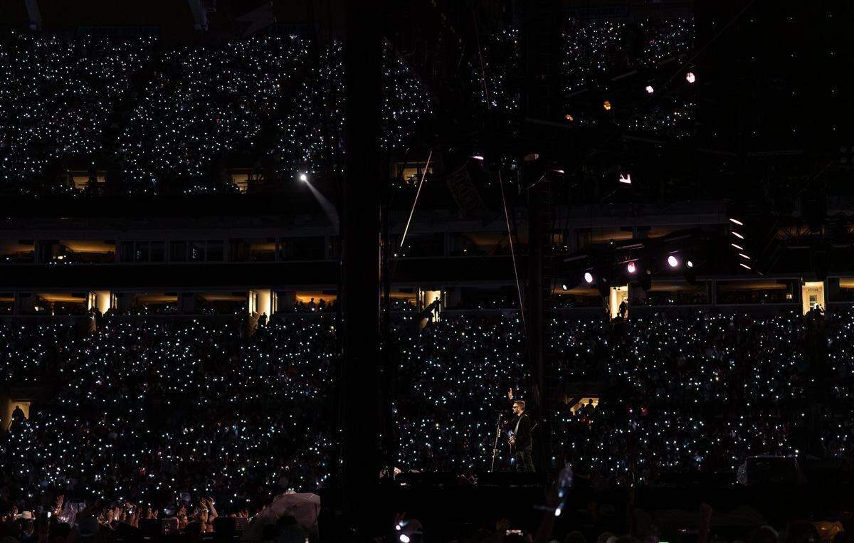 Cellphone lights dot Bank of America Stadium in October for Concert For Carolina.