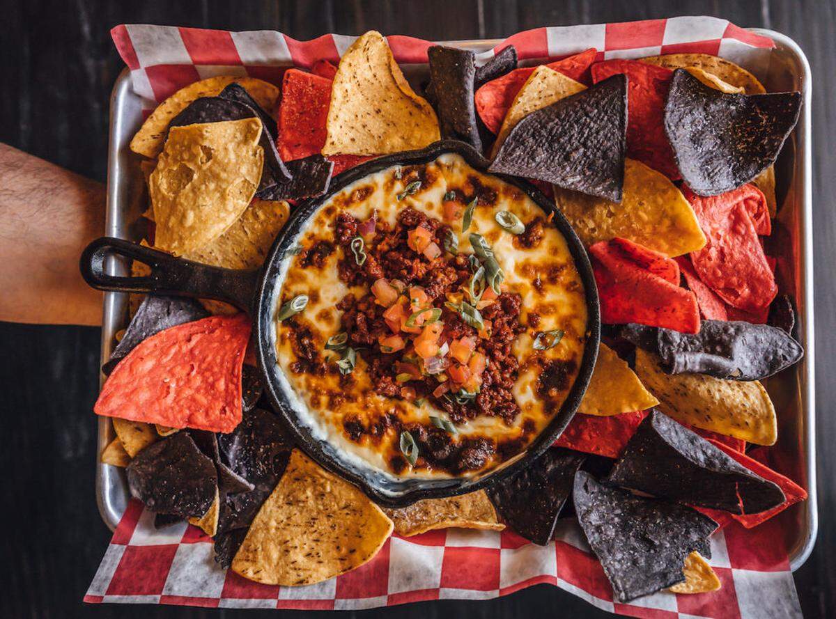 Photo by Houston Ray<br/>Skillet Chorizo Fundido at Pink Cactus: Four Cheese Blend, Chorizo, Pico De Gallo, Green onion