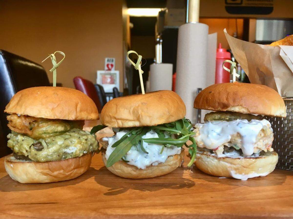 The Sriracha, the Bleu and Bacon Jam and The Pimento sliders. Photo by CharlotteFive