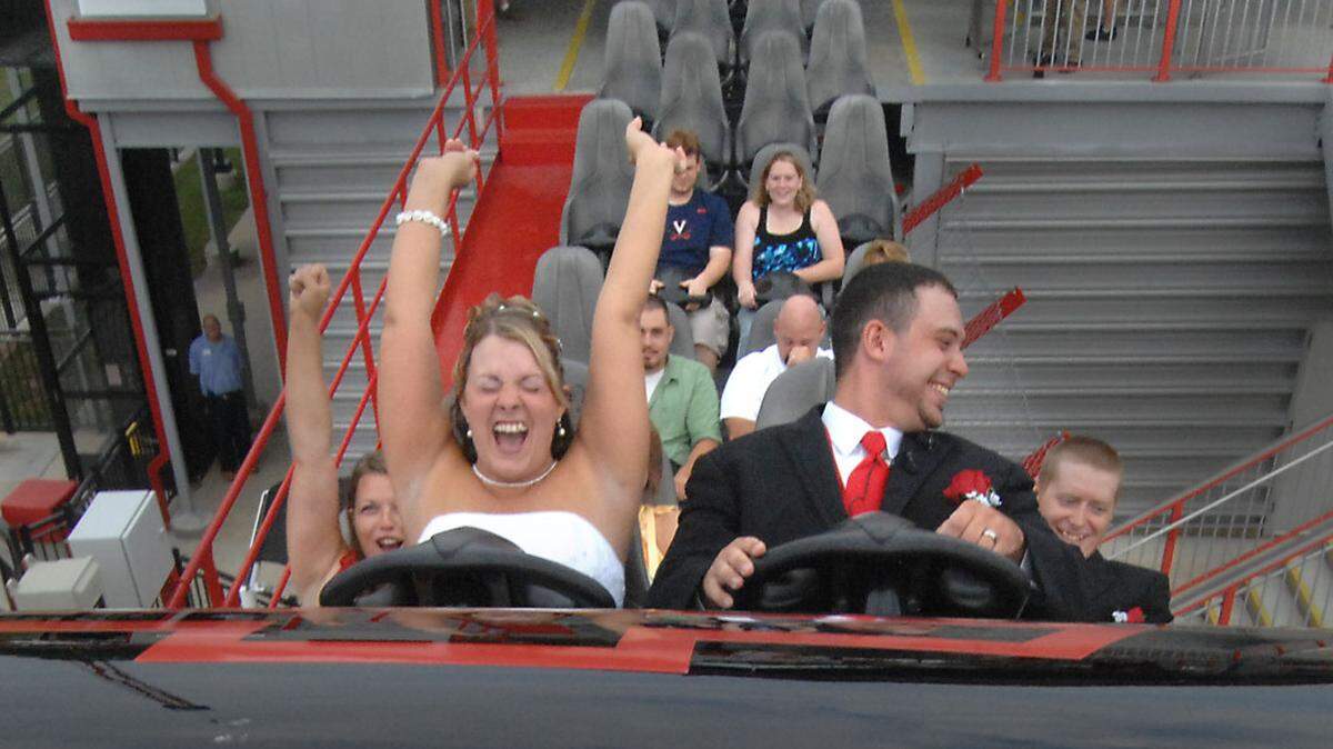8/20/2011 Wendy and Glen Swearengin take the plunge on the Intimidator at Carowinds Saturday morning. Glen proposed to Wendy on the coaster last year and the couple decided to tie the knot on the ride's platform. Todd Sumlin - tsumlin@charlotteobserver.com