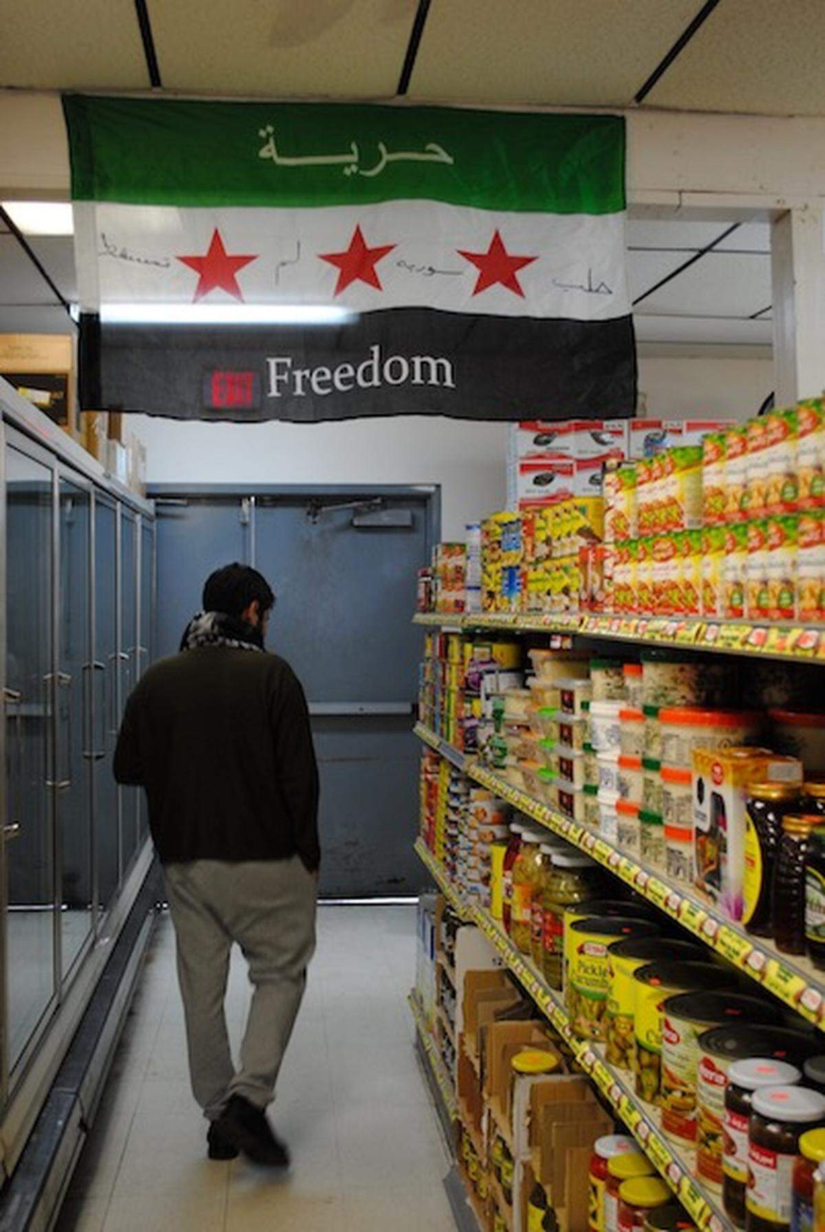 Khalil, 29, browses the shelves at Halal Market on N. Sharon Amity Road.