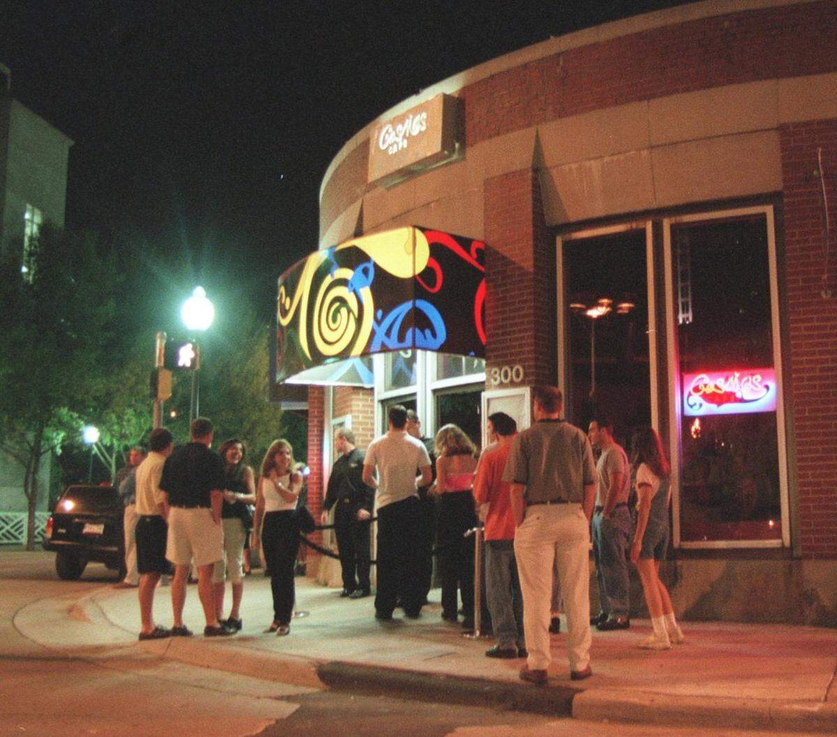 08/24/99  LIne outside Cosmos Cafe on a Saturday night.  Andy Kastanas, kingpin of the downtown bar scene in Mythos. Kastanas, a sometime DJ, has built a network of clubs and bars that have been packing in the crowds for years.  He owns Mythos, Cosmos, and Salamandra along with a few partners.  Kastanas has been a vital part behind the scenes for reviving downtown, organizing festivals, street parties, and giving people a reason to come downtown after dark.