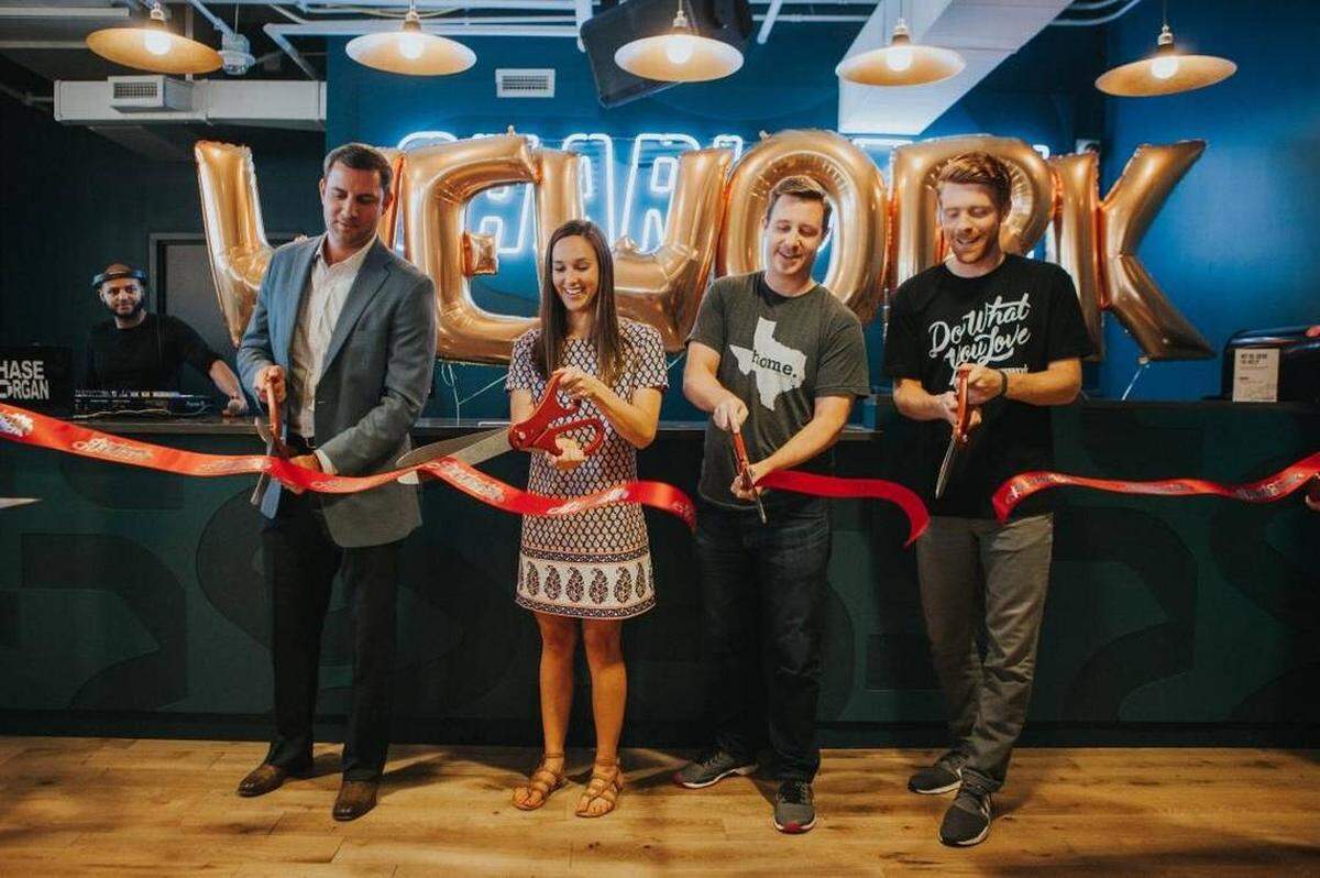 At Thursday’s WeWork ribbon cutting: John Ball of Trinity Partners, Audrey Rowe of the Charlotte Chamber, Ryan Shell of The Home T, and Adam Wacenske of WeWork