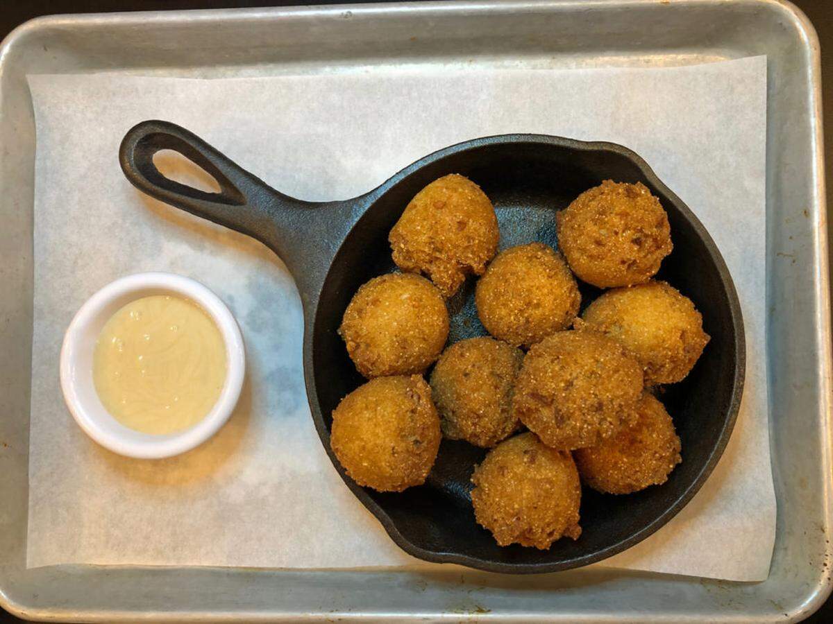 Photo by Sara Kendall<br/>Improper Pig hush puppies