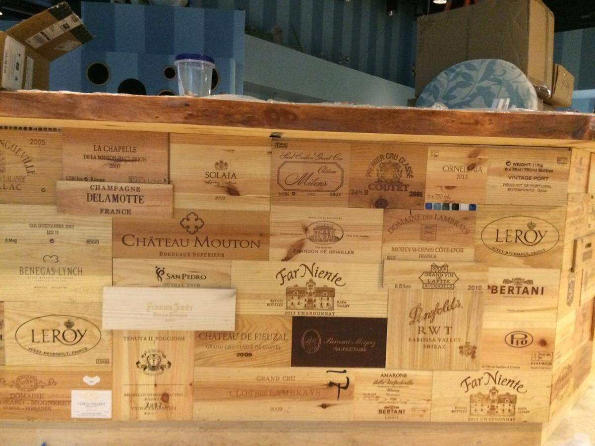 The main bar, with a collage of wine crates on the front.