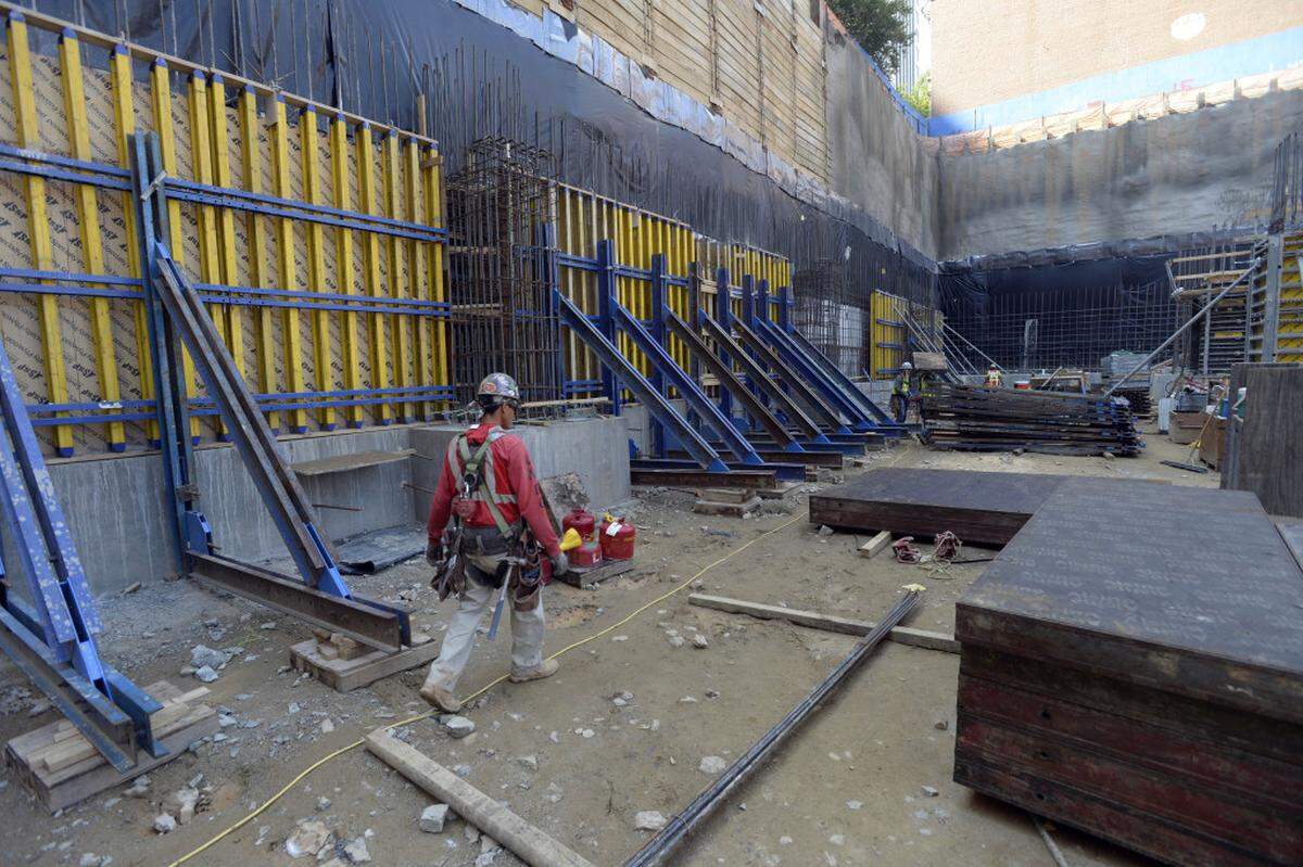 Work continues as the foundation is being set  at the bottom of the construction site of uptown's newest office and hotel tower at 300 South Tryon on Tuesday, August 25, 2015.