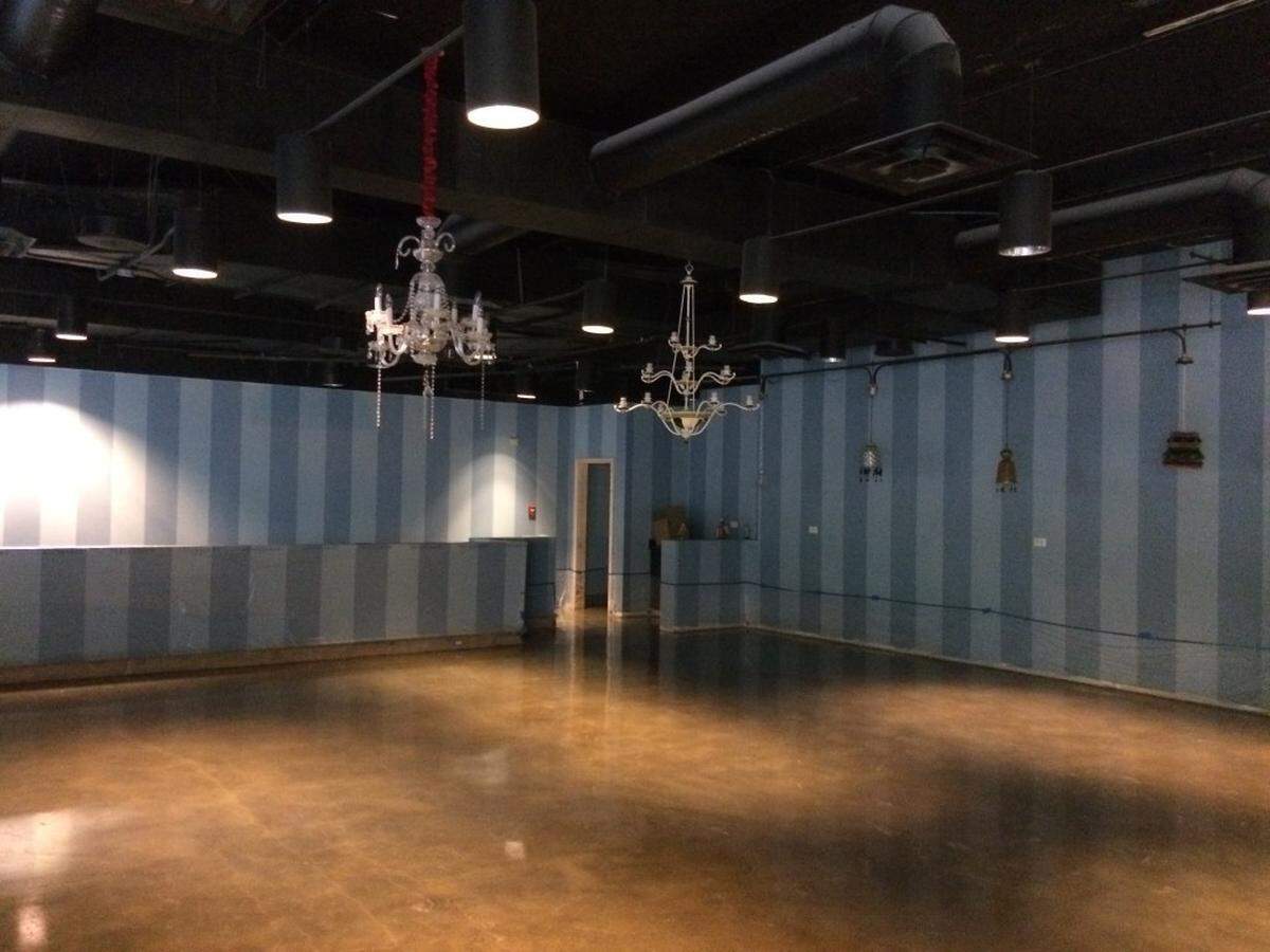 An event space on the highest level of the space, looking out over the rest of the restaurant.