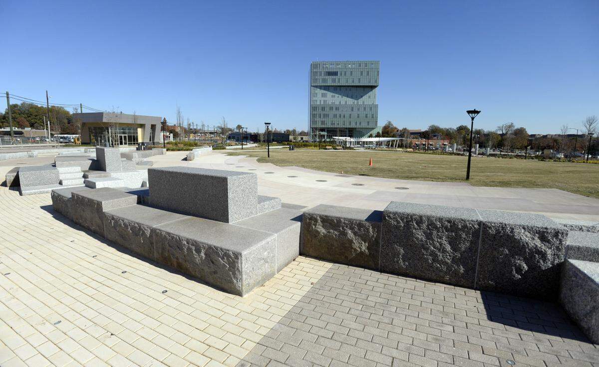 A view of the new First Ward Park with UNC Charlotte's uptown building, rear, on Monday, November 23, 2015. Mecklenburg County will take ownership of the park, developed by Levine Properties, after paying the development company $8 million for the 4-acre facility.