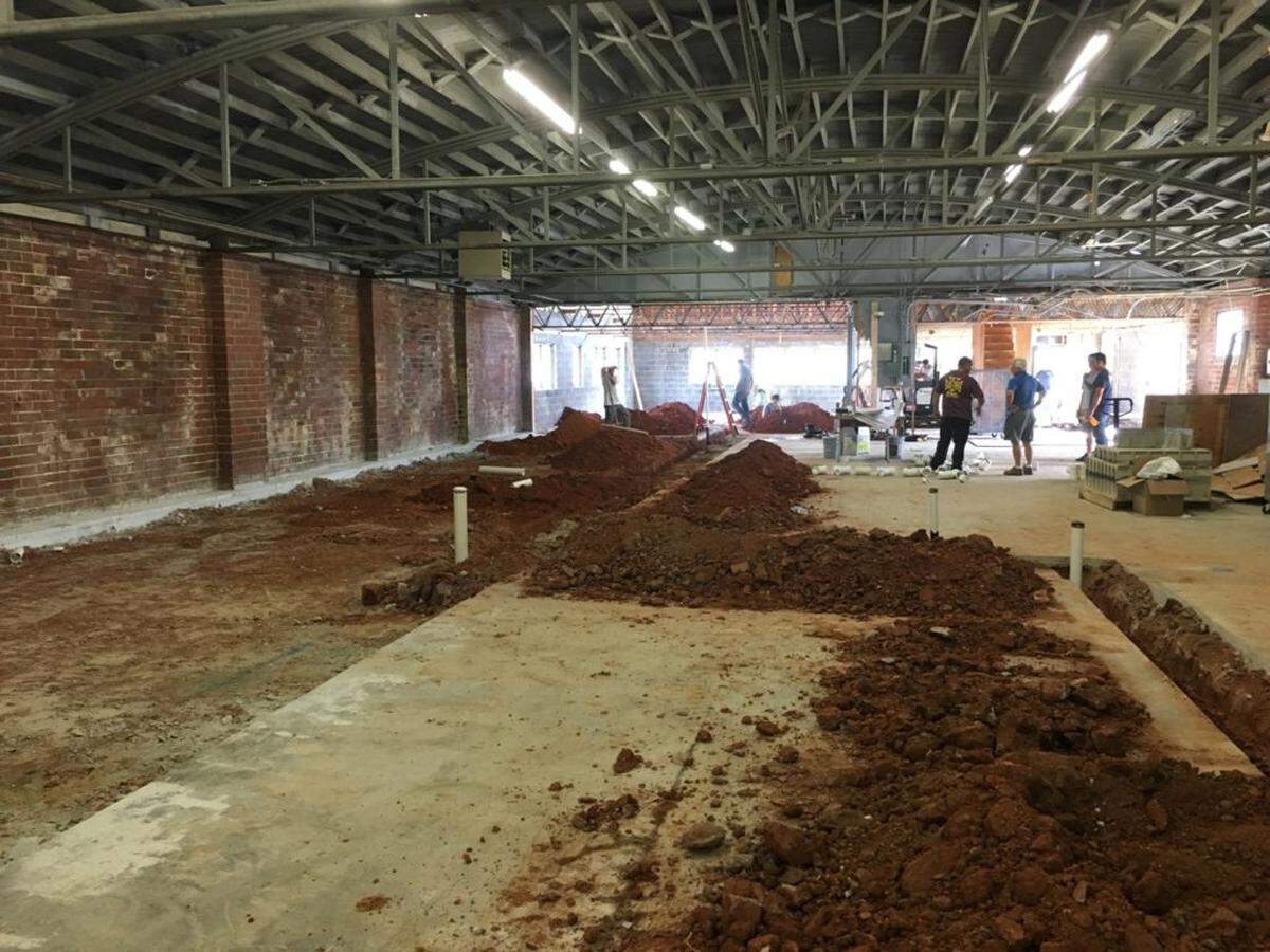 A shot from the back of the space. The event space is on the right side of this photo and the tanks will line the wall on the left.