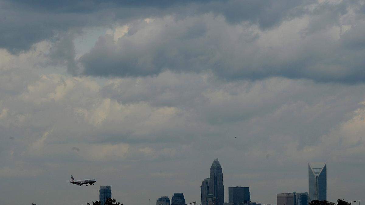Planes take off and land in a cloudy sky at Charlotte/Douglas International Airport on Friday July 3, 2015.  Itâ€™s beginning to look like the dry start of summer may continue, despite expected showers and thunderstorms Thursday and Friday. A seasonal outlook by the National Oceanic and Atmospheric Administration says drought is likely to develop in central North Carolina through September. The Catawba River basin including Charlotte is in the lowest stage of drought, a water-management board said Thursday.