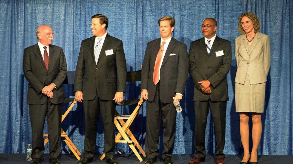 Charlotte Mayor Dan Clodfelter, left, Republican candidate Scott Stone , Republican candidate Edwin Peacock III, Democratic candidate Michael Barnes, and Democratic candidate Jennifer Roberts mingle onstage prior to the start of The Charlotte Observer/WBTV mayoral debate sponsored by Duke Energy and hosted by Queens University of Charlotte on Tuesday, September 1, 2015.
