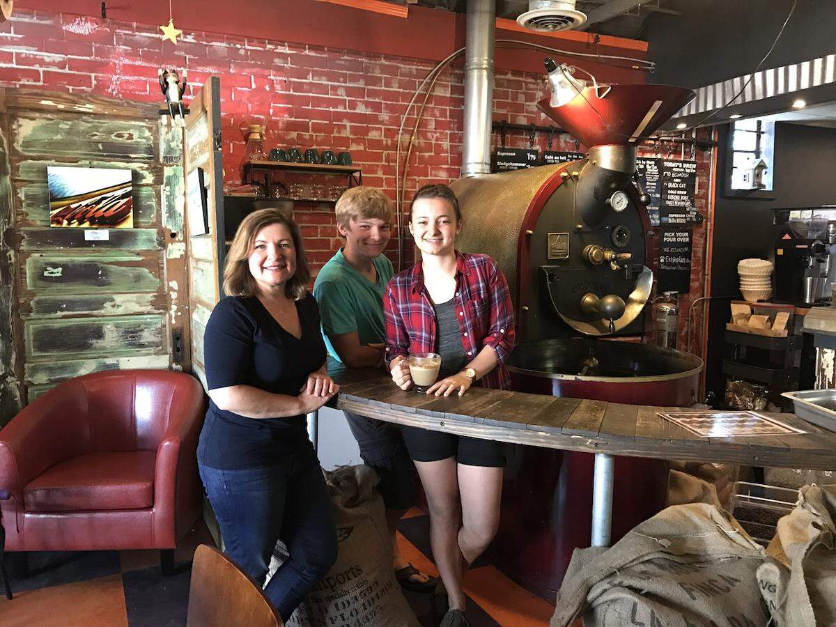 Smelly Cat Coffeehouse is owned and operated by the Tuman family. From left: Cathy Tuman, R.J. Russell and Taylor Russell.