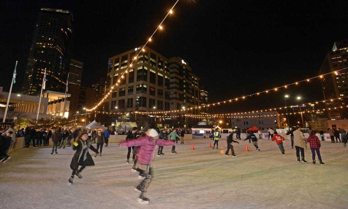 In this 2015 file photo, skaters enjoy opening night of the Holiday on Ice outdoor rink at NASCAR Hall of Fame Plaza in uptown Charlotte. The pandemic forced the cancellation of the event the past two years.