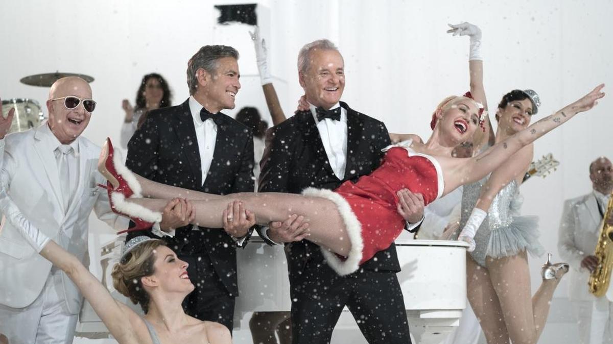 Paul Shaffer, George Clooney, Bill Murray, and Miley Cyrus in "A Very Murray Christmas."