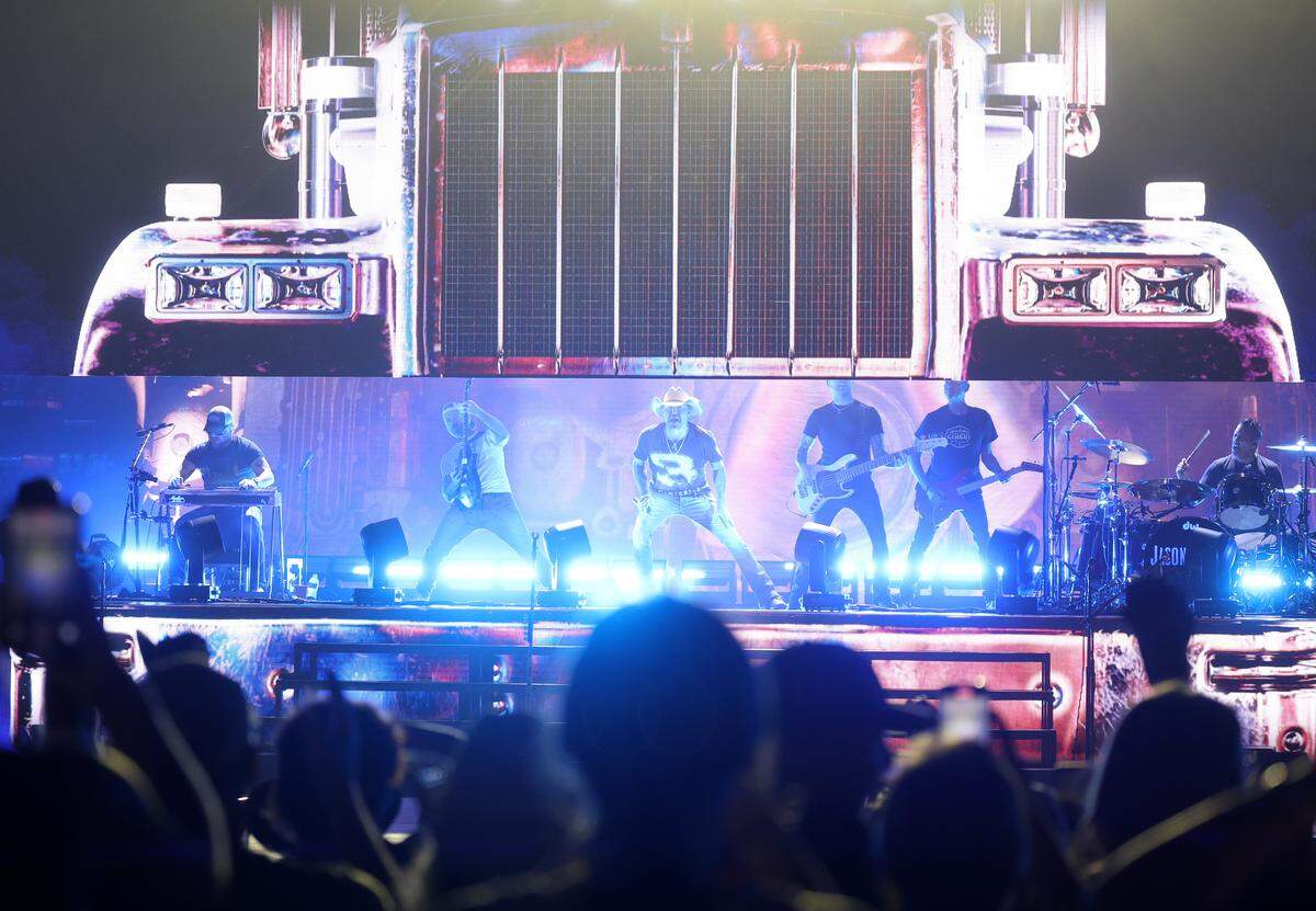 Country music artist Jason Aldean, center, peforms Friday, Aug. 22, 2022 at the PNC Pavillion in Charlotte.
