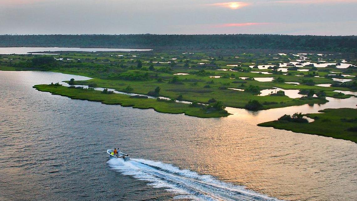 A boat speeds through the water near North Topsail Beach, which was named one of the trendiest summer travel spots in the country.