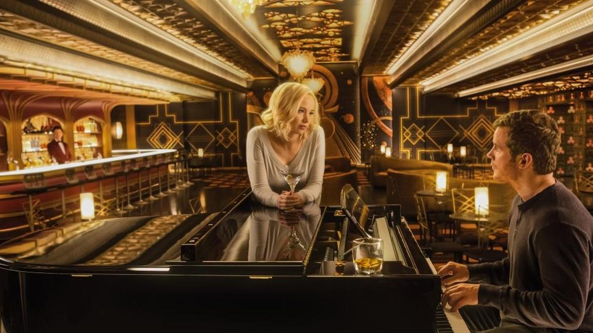 Jennifer Lawrence, center, Chris Pratt, right, and Michael Sheen, left, in the film “Passengers.”