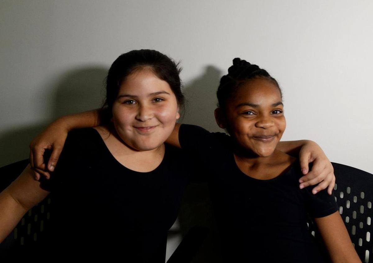 Dancers Eva Bonus, left, and Laila Jones take a moment out of rehearsal for “The Rite of Spring.” Laila says the ballet depicts “everything coming back to life.”