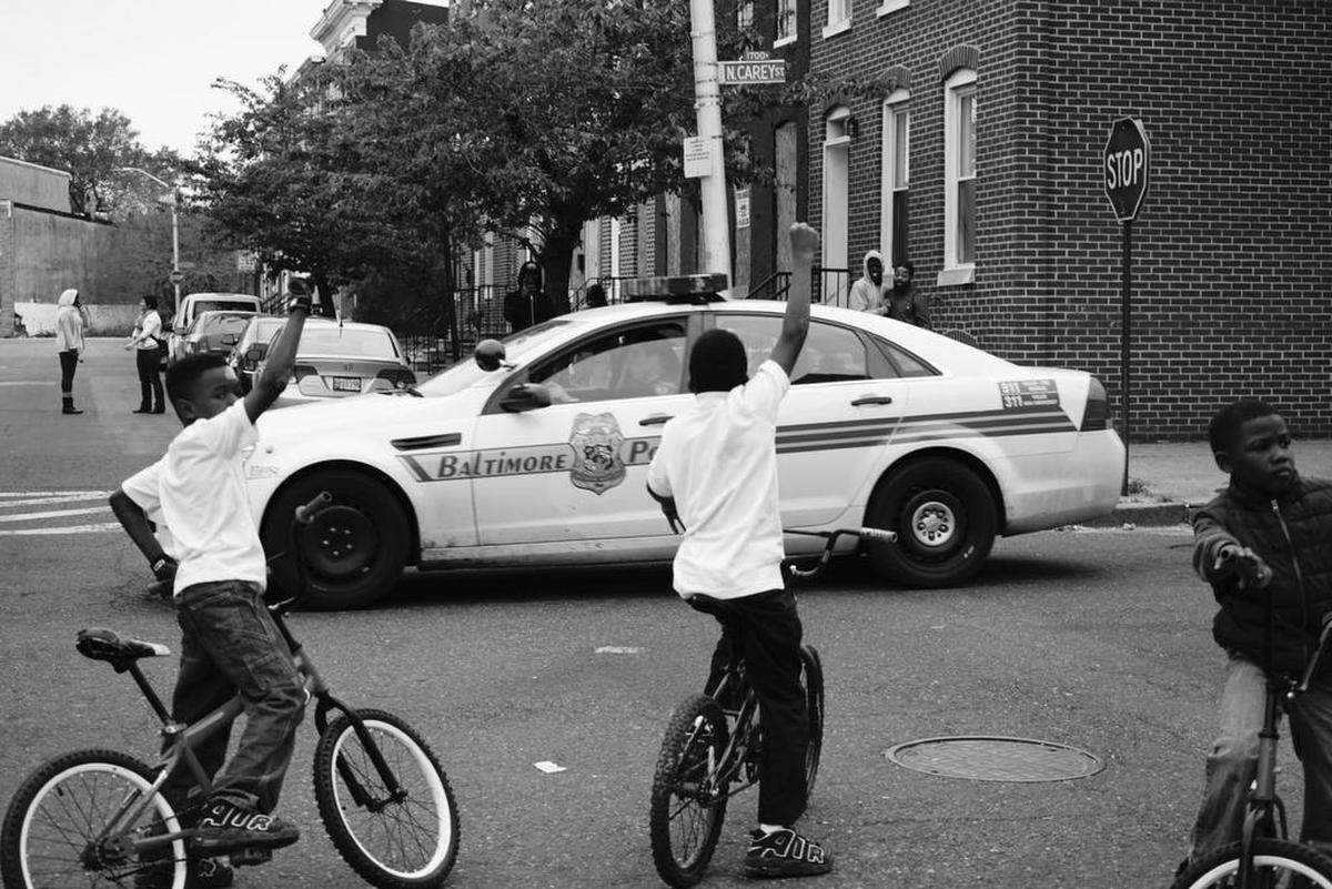 A photograph by Shan Wallace, taken in Baltimore near the one-year mark after Freddie Gray’s death.
