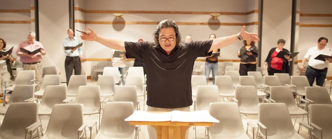 Director David Tang conducts a Vox rehearsal at St. John’s Baptist Church in this 2015 file photo.