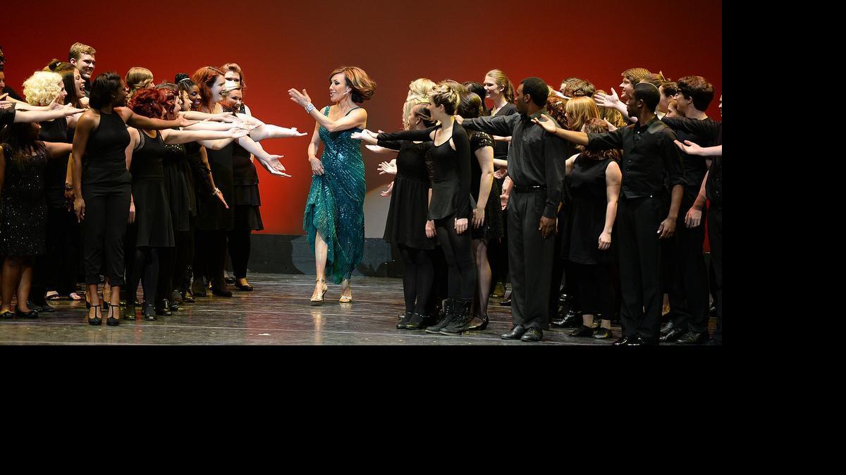 
Maureen O'Boyle is introduced as she comes onto the stage during the opening production number at the 2014 Blumey Awards at the Belk Theater. 
