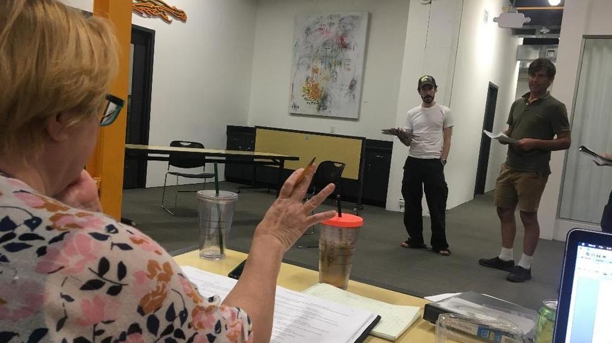Anne Lambert talks with Berry Newkirk and Paul Gibson in rehearsal.