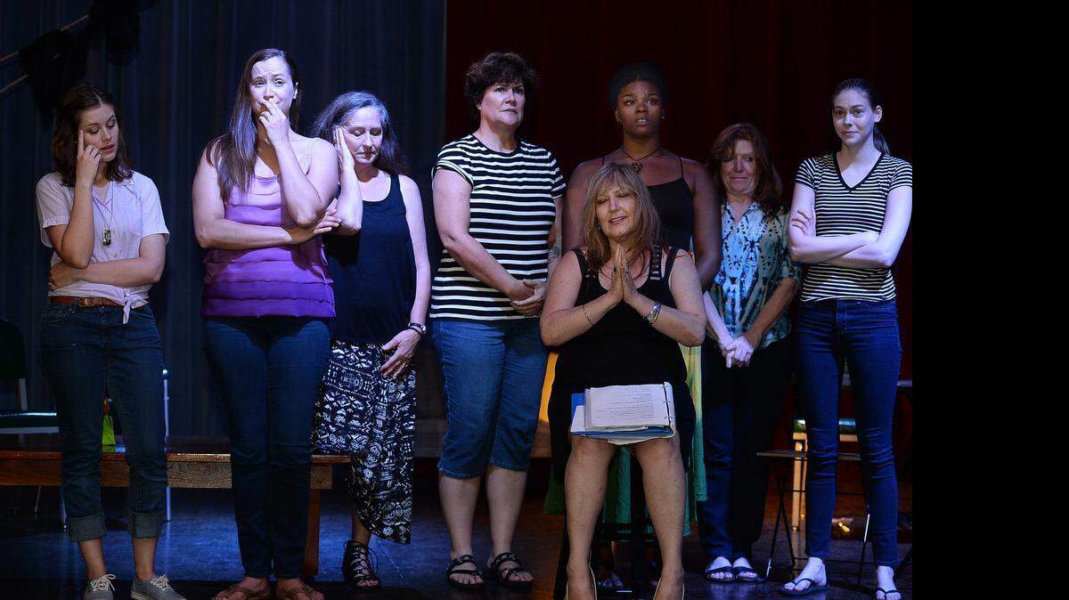 
“The Loss World Monologues” author Mary London Szpara, seated front right, rehearses with Hannah Taylor, Mandy Smith, Susan Tobelman, Nancy Brennan, Brianna Daniels, Robin Weaver, and Brittany Bass. Nine actresses from their 20s through their 50s create interlocking stories of loss and survival.
