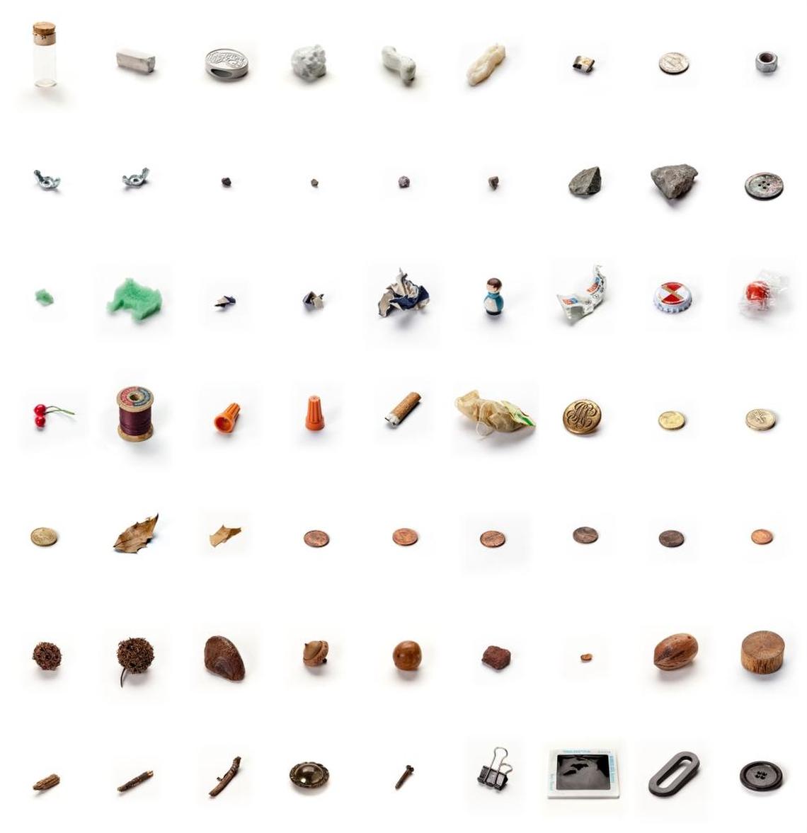 “63 Objects Taken Out of My Son's Mouth,” 2011-12, by Lenka Clayton; acorn, bolt, bubblegum, buttons, carbon paper, chalk, Christmas decoration, cigarette butt, coins (GBP, USD, EURO), cotton reel, holly leaf, little wooden man, sharp metal pieces, metro ticket, nuts, plastic "O", polystyrene, rat poison (missing), seeds, slide, small rocks, specimen vial, sponge animal, sticks, teabag, wire caps and wooden block.