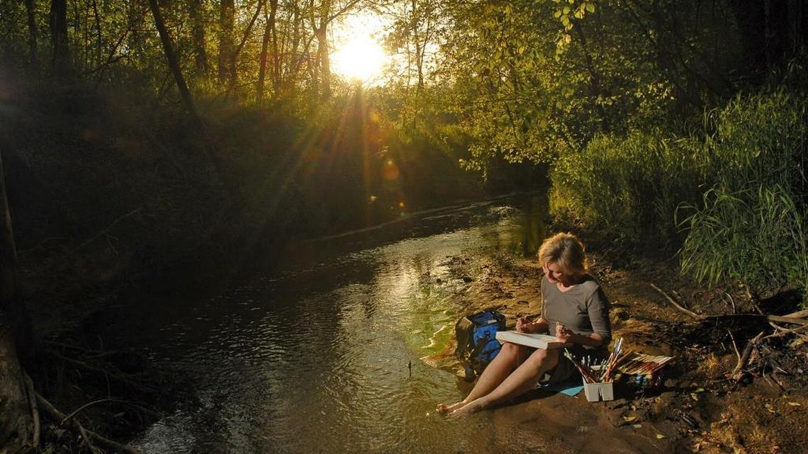 This 2007 photo shows Elizabeth Bradford working at one of her favorite spots: a sandbar in a creek, Ramah, that her family has lived near for more than a century.