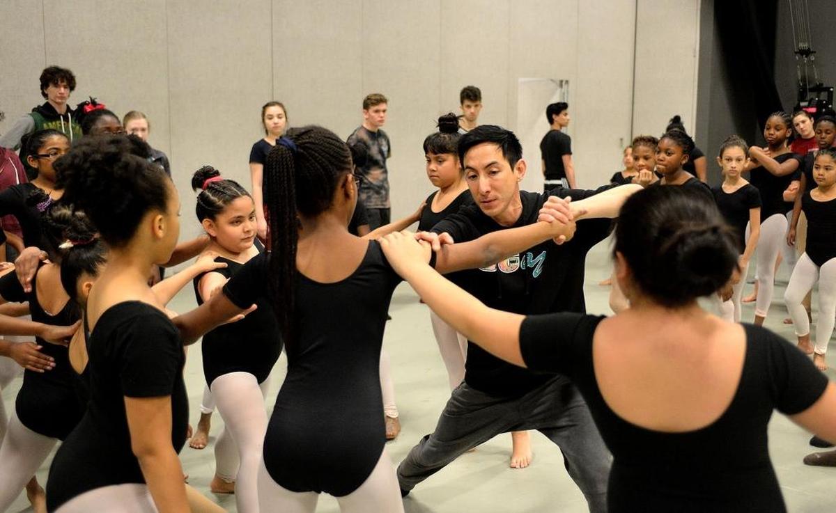 “I’ve been all over the dance world,” says choreographer Peter Chu, working with Charlotte kids in a collaboration with Charlotte Ballet and the Charlotte Symphony, “and the Reach program is one of the best of its kind I’ve seen.”