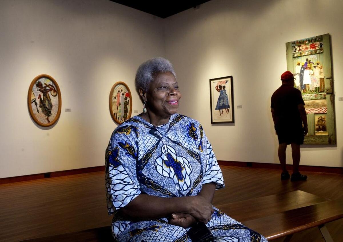 Charlotte mixed media artist Nellie Ashford depicted African-Americans playing, voting and worshiping in segregated, small-town Charlotte in her 2016 Gantt Center show.