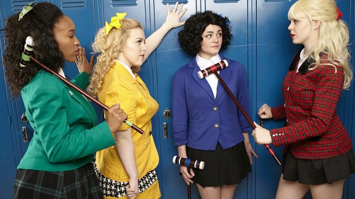 The Heathers – Nonye Obichere (in green), Ava Smith (yellow) and Tessa Belongia (in red) – of “Heathers,” plus Veronica (KC Roberge), in blue.