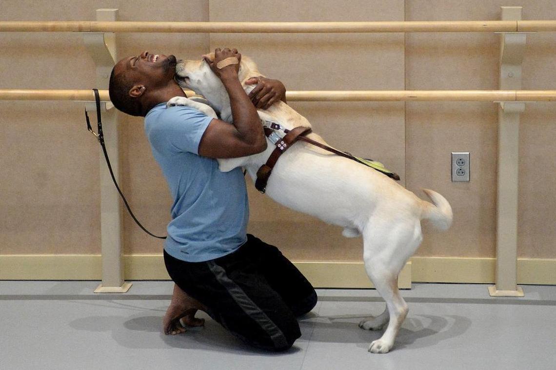 Charlie, Davian Robinson’s guide dog, accompanies him to rehearsals.