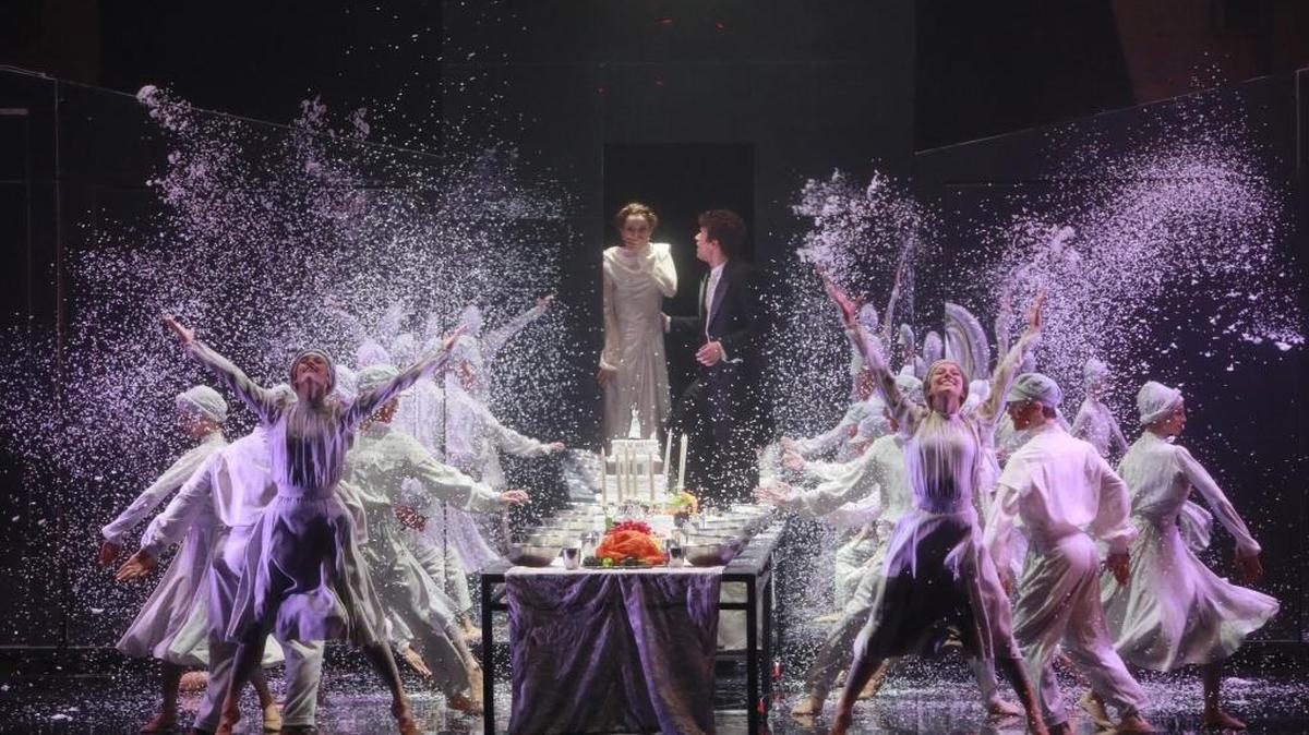 Chelsea Dumas and Josh Hall (center back) in one of many visually arresting scene in Charlotte Ballet’s “The Most Incredible Thing.”