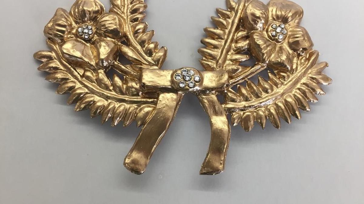 Brooches like Little Edie’s weren’t available for what Matthews Playhouse’s June Bayless calls “a reasonable price” – so, she said, John Bayless just made several himself (via sculpting and molds).