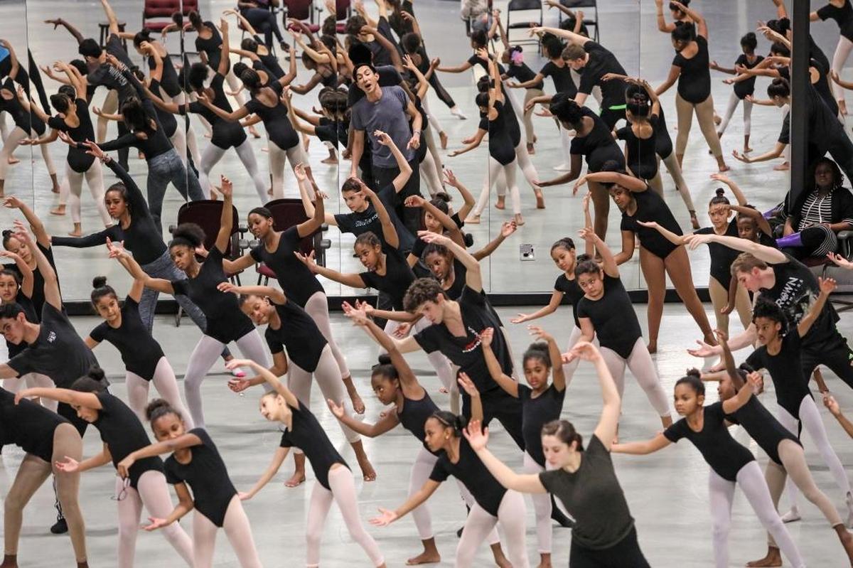 Amid a sea of Charlotte kids with some pros mixed in, choreographer Peter Chu (there he is, in the back, in a gray T) works toward the performances coming up April 6-7.