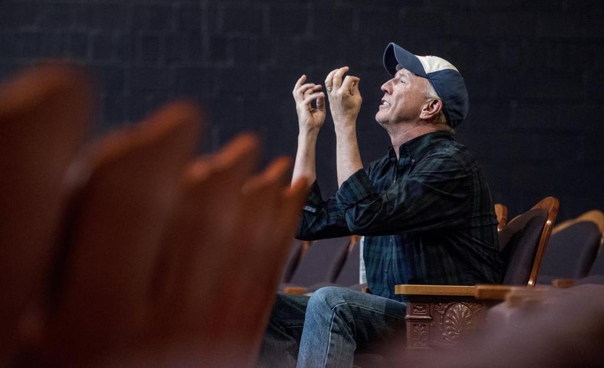 Ensley demonstrates an emotion he’s looking for during rehearsal at Theatre Charlotte.