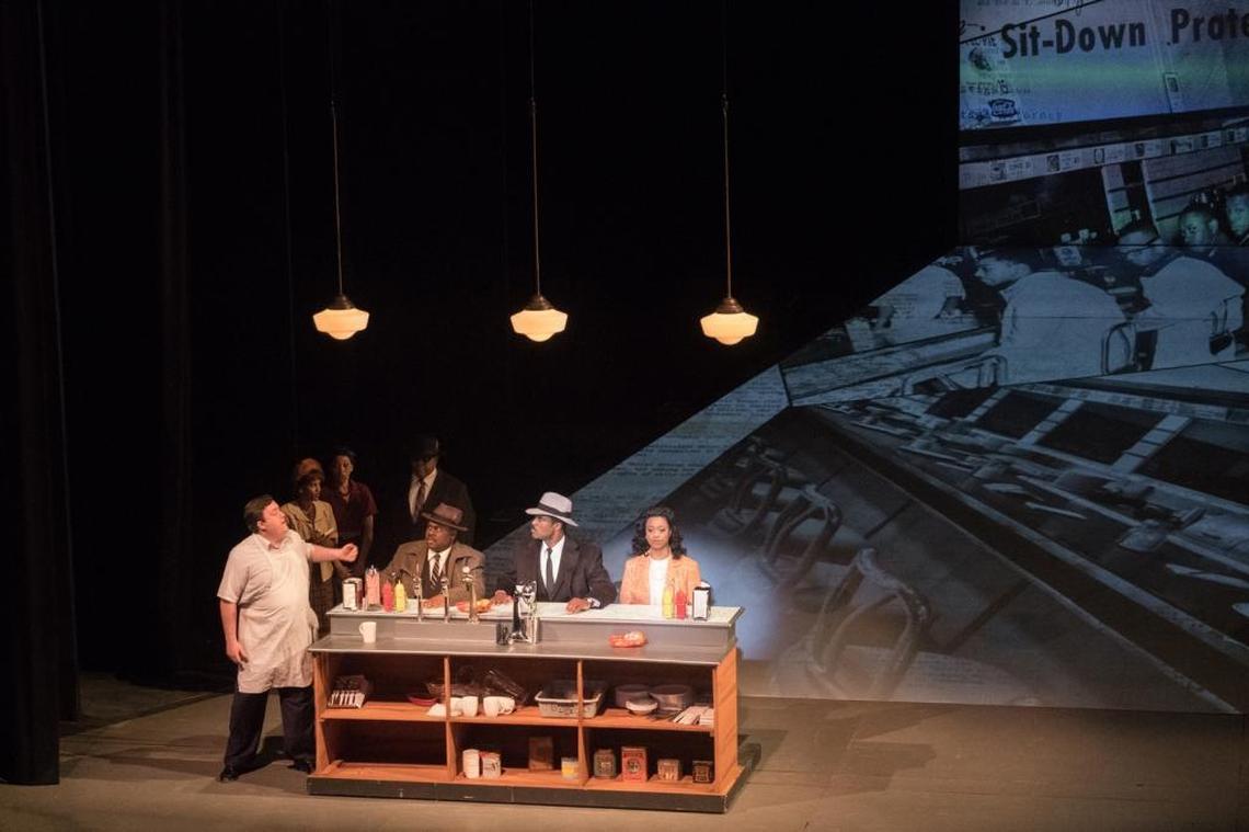 Taking a seat at a whites-only lunch counter: Ralph, Martin and Coretta (Laquita Mitchell).