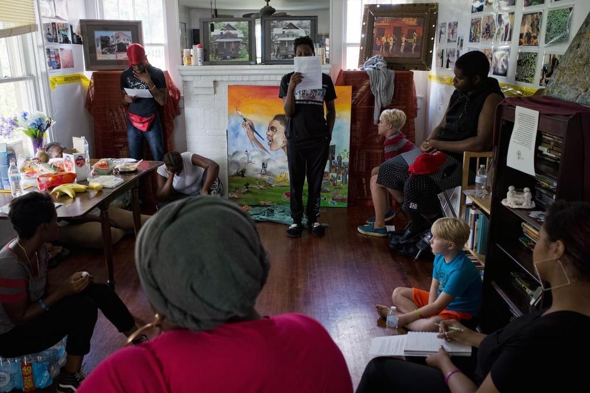 Zun Lee made this photograph at a rehearsal for QC Family Tree’s “Muddy Turtle Talks,” coming up Sept. 15. Under artist/ storyteller Hannah Hasan’s watchful eye, TyJuan McFadden and Tayshaun Harris rehearse their spoken word stories in front of the youth group at QC Family Tree.