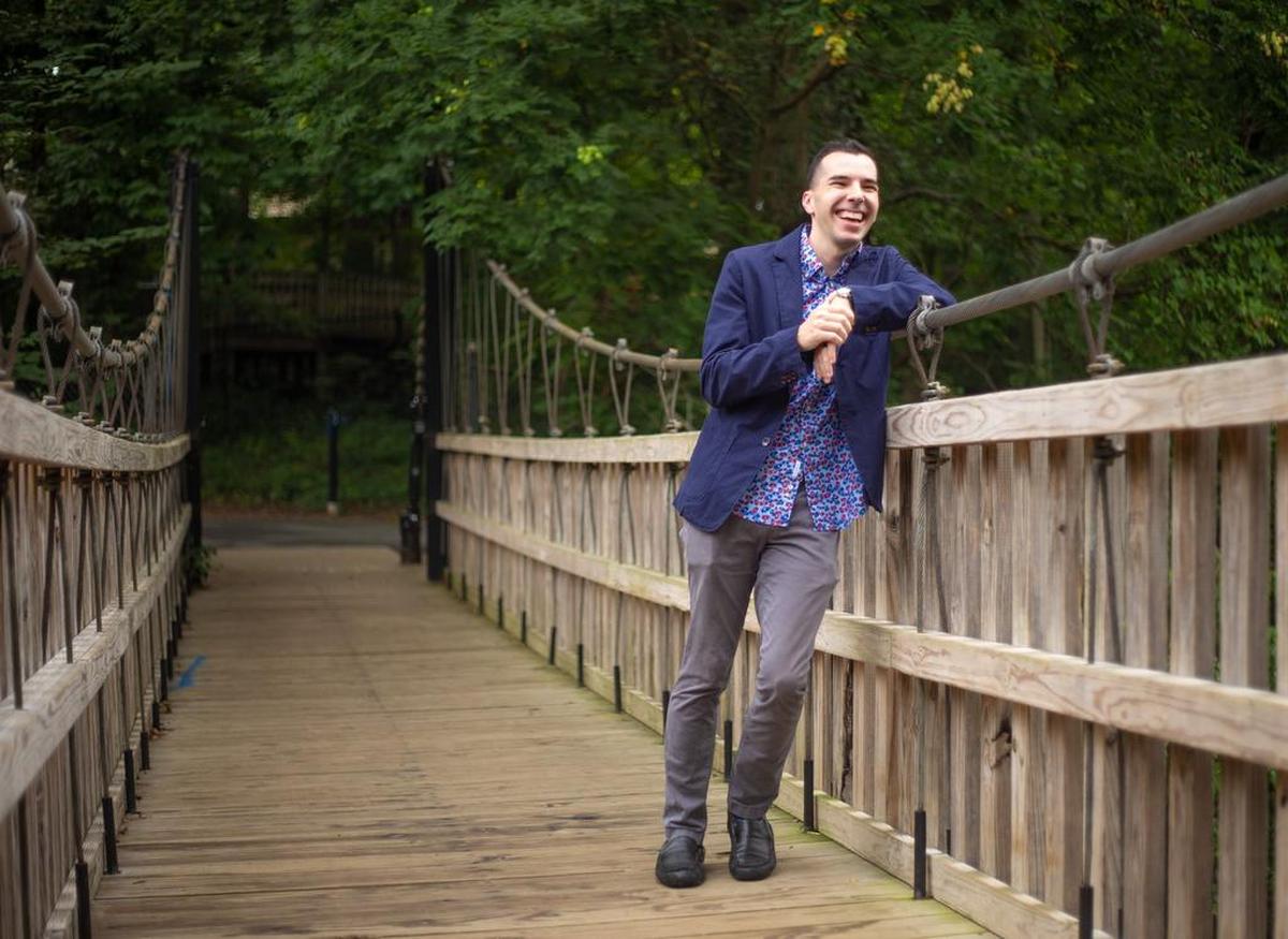 Actor/illusionist/occasional giraffe Caleb Sigmon pauses between offering tricks to passers-by in Freedom Park. “Basically what I get to do is pretend for a living, and I love it.”