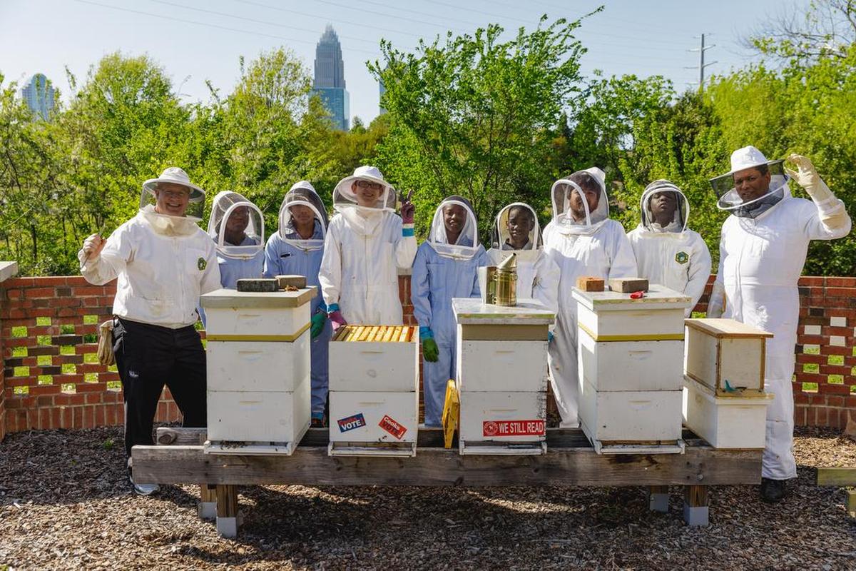 Learning about beekeeping, outside the Van Avery Culinary Arts Center at CPCC.