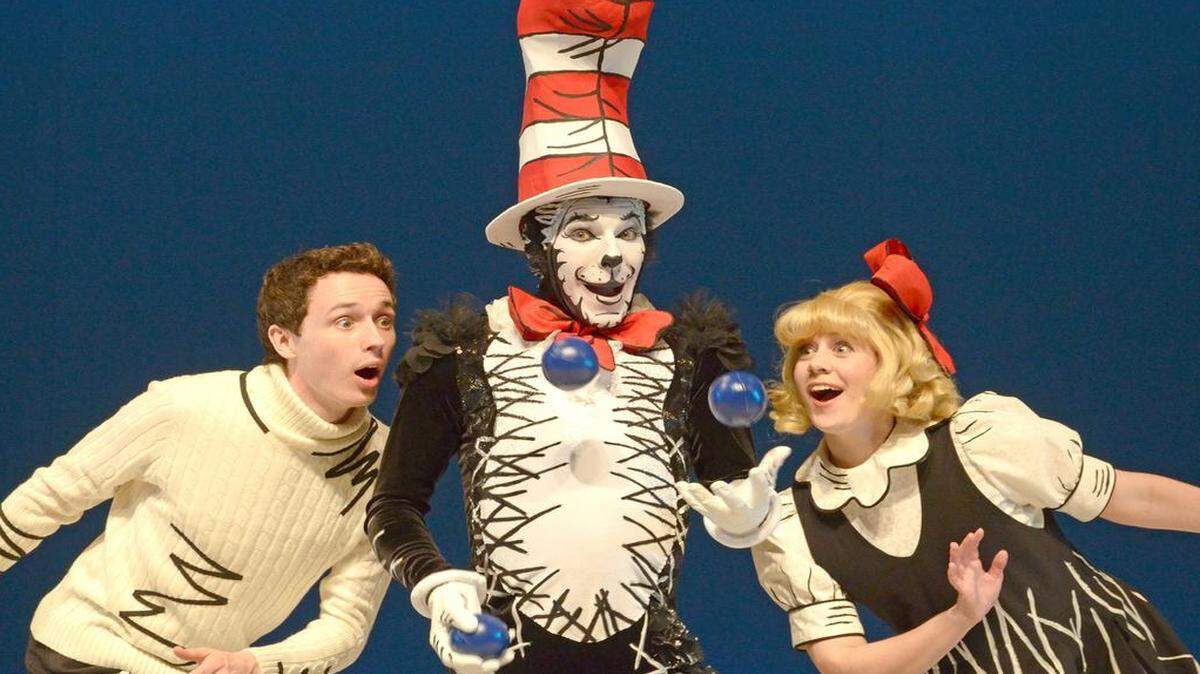 
The title character (Caleb Ryan Sigmon) offers questionable advice to youngsters (Chester Shepherd and Margaret Dalton) in Children’s Theatre’s “The Cat in the Hat.”
