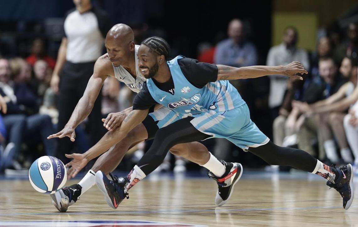 Famous Los, right, and Ray Allen chase the ball during the first half of the NBA All-Star Celebrity Game.