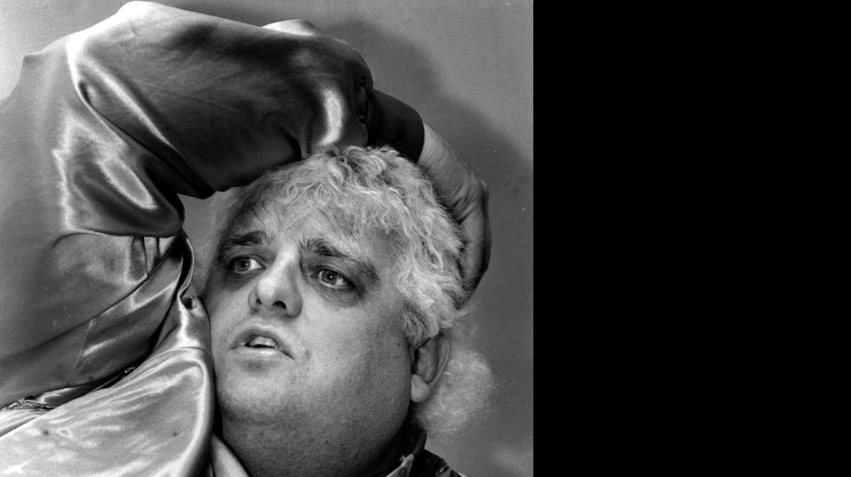 
Professional wrestler Dusty Rhodes, The American Dream, relaxes backstage before a bout at Raleigh’s Dorton Arena in 1985. 
