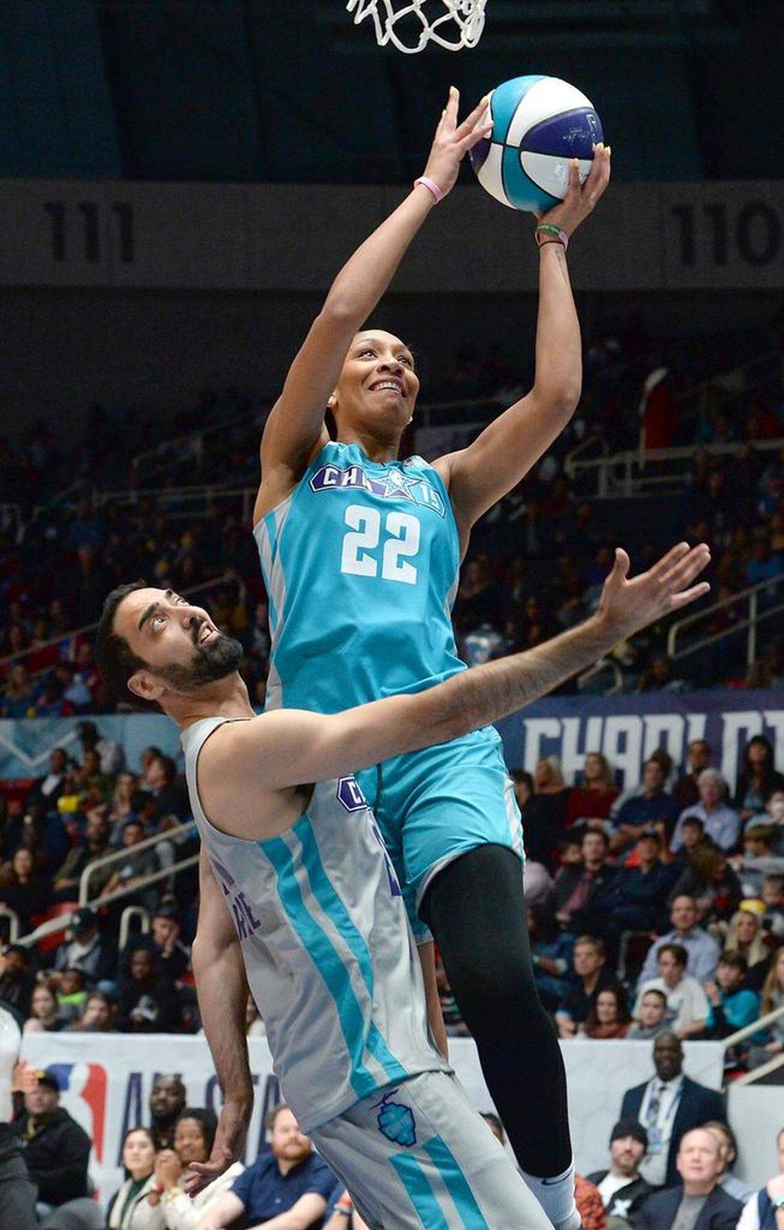 A’ja Wilson, a former South Carolina Gamecocks women’s player and current WNBA player for the Las Vegas Aces, drives to the basket for two points over Ronnie 2K during the NBA All-Star Celebrity Game at Bojangles’ Coliseum on Friday night.