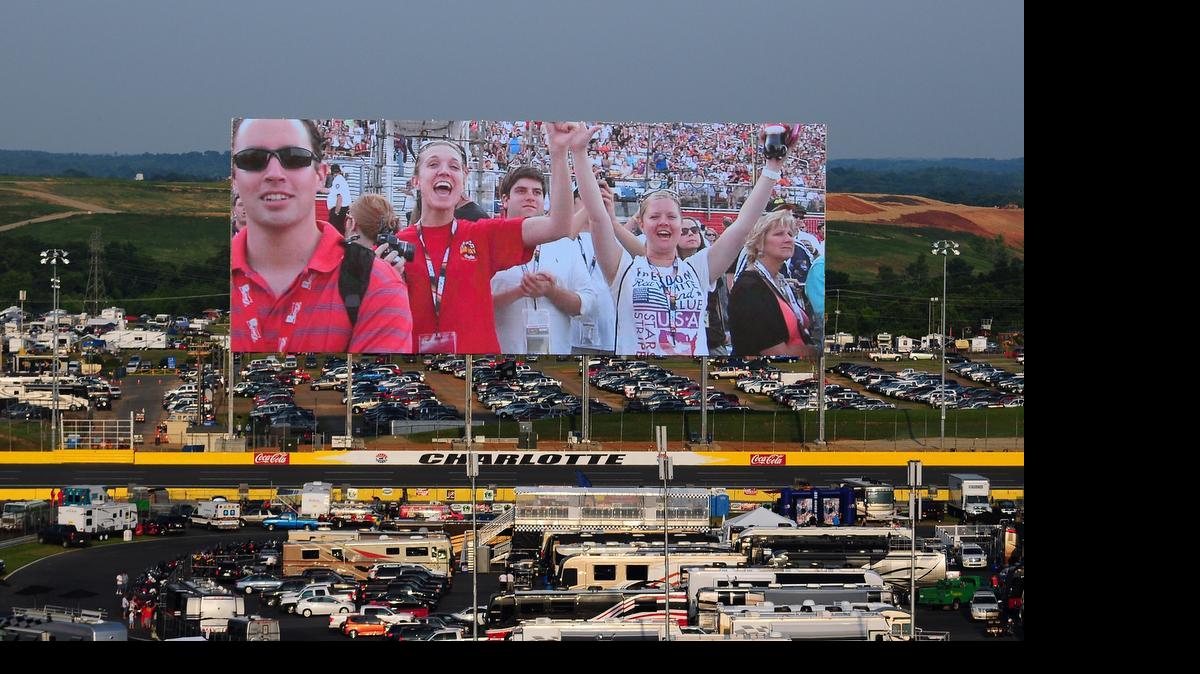 
Fans are shown on the world's largest HDTV at Charlotte Motor Speedway. It’s 80 feet by 20 feet. “It’s taller and wider than the White House,” said Scott Cooper, Speedway director of communications. 
