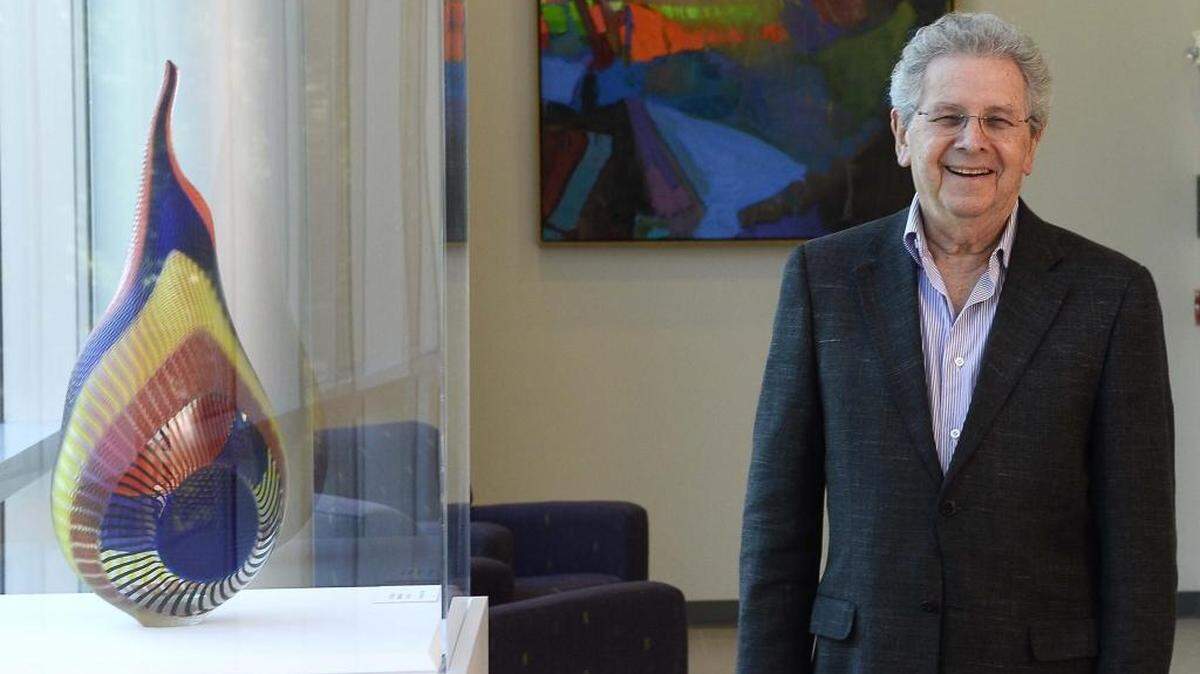 
Bill Gorelick with carved glass titled “Bilboa HG 436” by artist Lino Tagliapietra. Behind is oil on linen titled " Sleepsong 11" by artist Brian Rutenberg at the new Patty and Bill Gorelick Gallery at CPCC Harris Campus.
