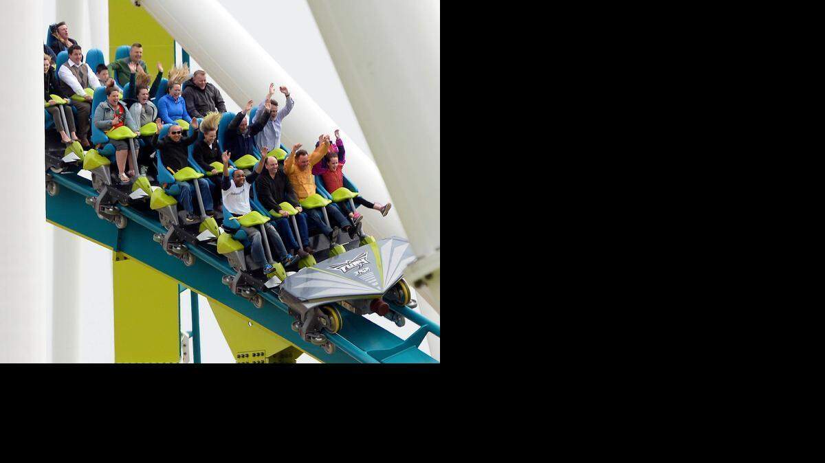 
Roller coaster riders enjoy their experience on Carowinds' new Fury 325, the world tallest and fastest giga coaster, during media day on Wednesday, March 25, 2015. 
