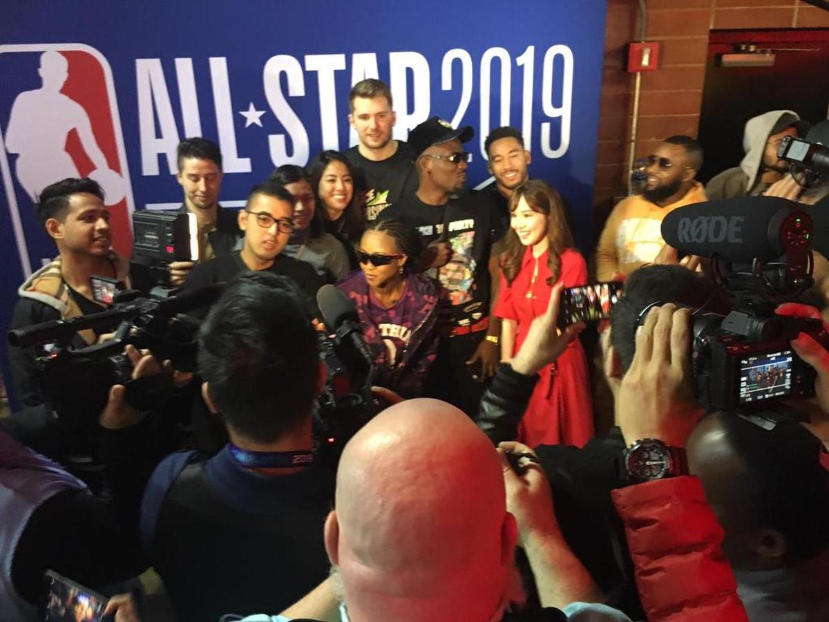 Members of the NBA international influencers program rub shoulders with the Dallas Mavericks’ Luka Dončić before the Rising Stars Game in Charlotte.